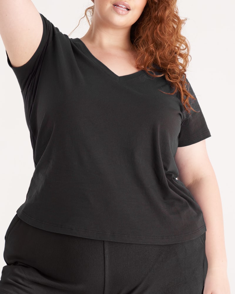 Front of a model wearing a size 3X The V Neck Tee in Onyx by The Standard Stitch. | dia_product_style_image_id:248763